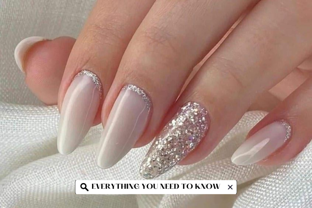 Close-up of manicured hands showcasing silver ombre nails, a trendy and chic nail art style.