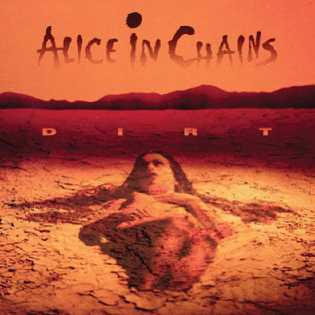 The haunting Alice in Chains Dirt cover, showing a woman lying in barren earth—an unforgettable symbol of pain and power in grunge music.