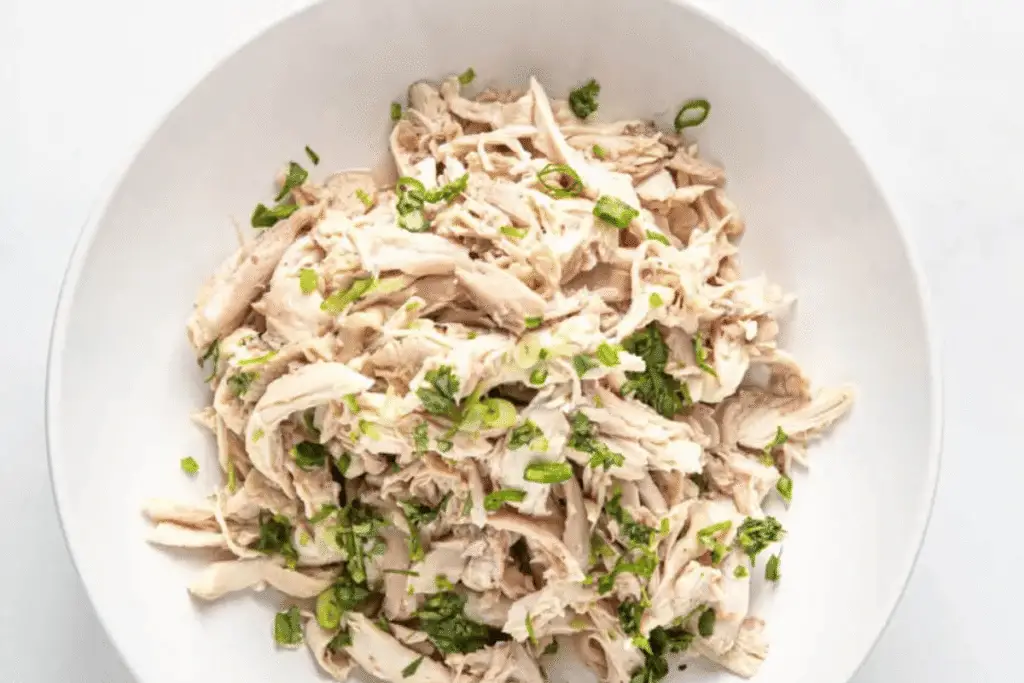 Shredded chicken in a bowl, perfect for tacos or wraps – versatile Gluten Free Instant Pot Recipes.
