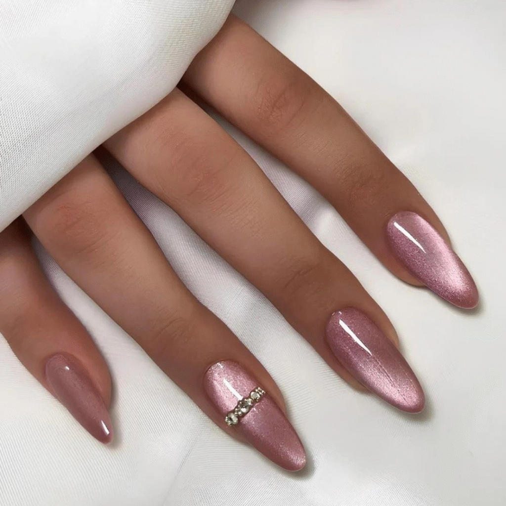 Medium pink cat eye nails glowing with a romantic magnetic sheen.