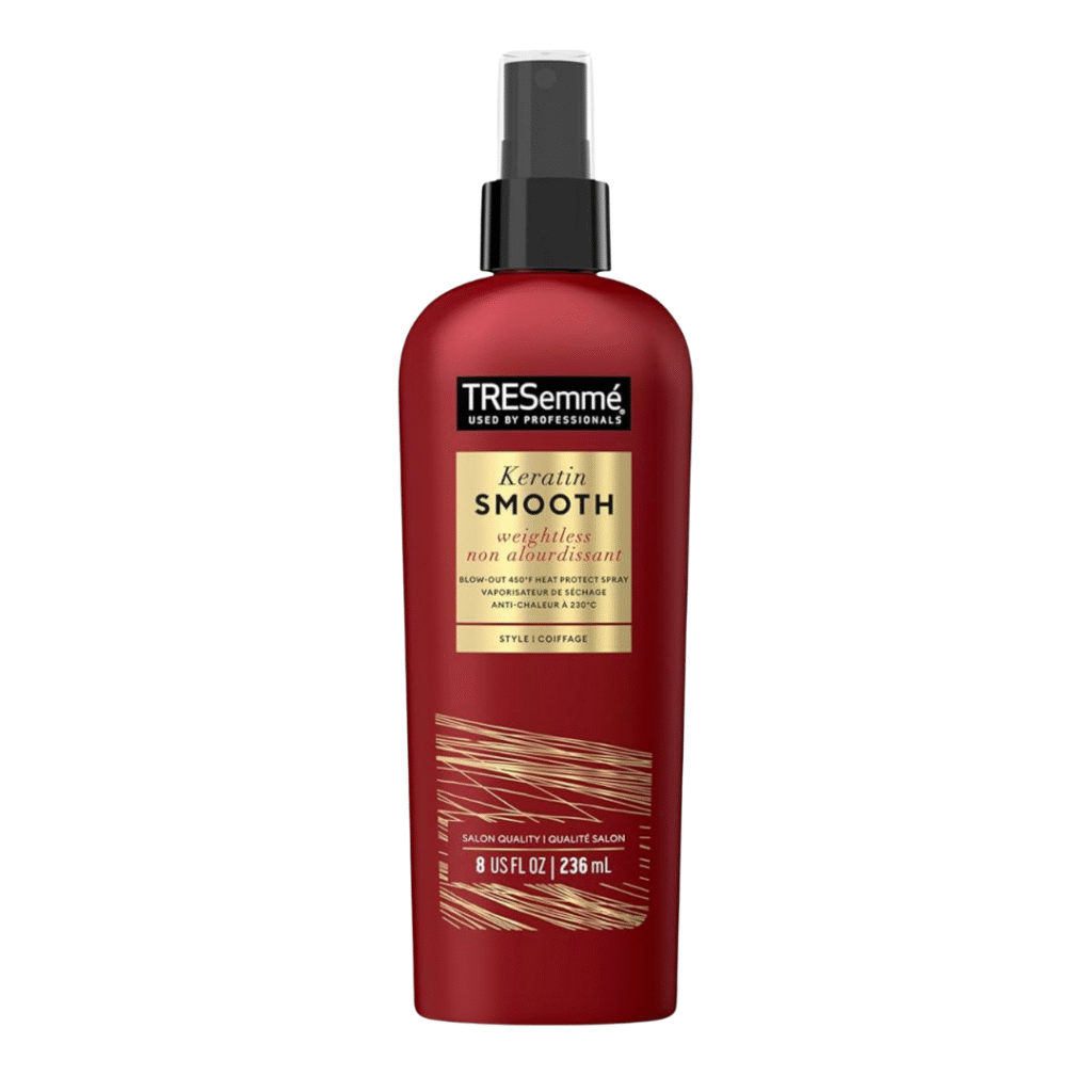 Tresemmé Thermal Creations Heat Tamer spray shown as a protective product for how to style curtain bangs, shielding hair from heat while styling.